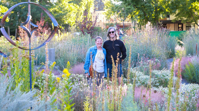 Woman and man smiling in their summerhome garden